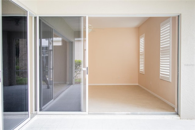 interior space featuring plenty of natural light and carpet