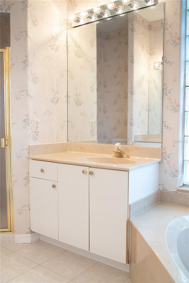 bathroom featuring tile patterned flooring and vanity