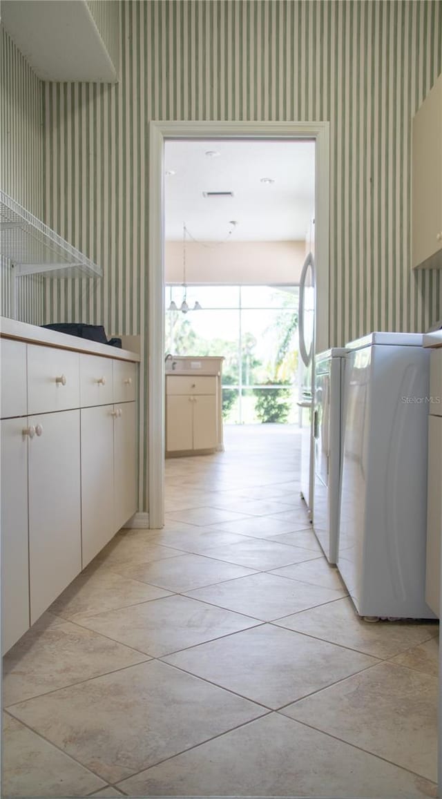 view of horse barn featuring washer and clothes dryer