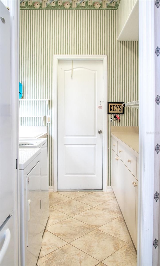 doorway featuring independent washer and dryer