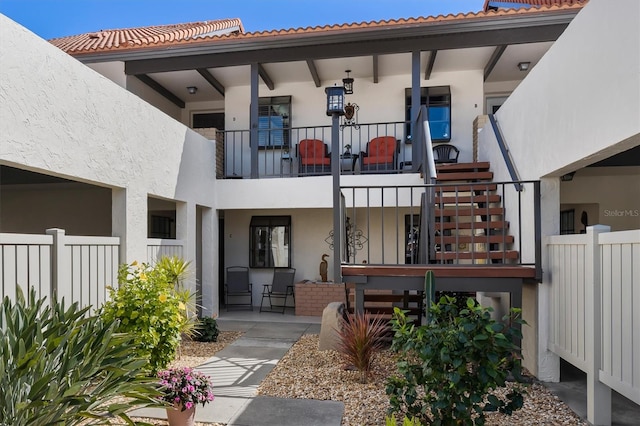 exterior space with a patio and a balcony