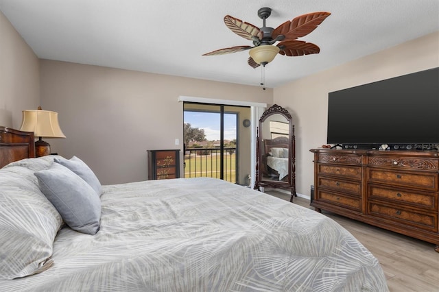 bedroom featuring ceiling fan, light hardwood / wood-style floors, and access to exterior