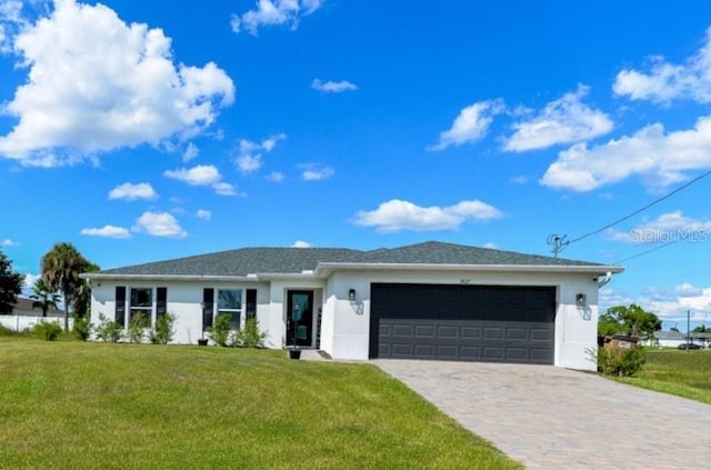 ranch-style home with a garage and a front yard