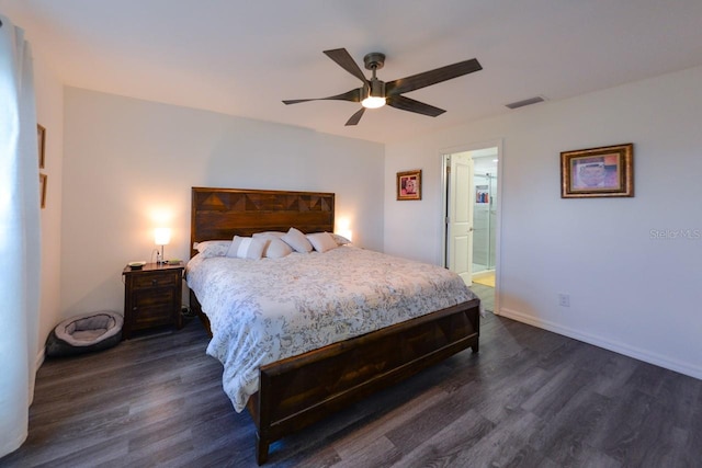 bedroom with dark hardwood / wood-style flooring, ceiling fan, and ensuite bath