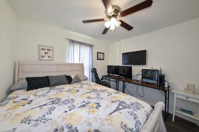 bedroom with dark wood-type flooring and ceiling fan