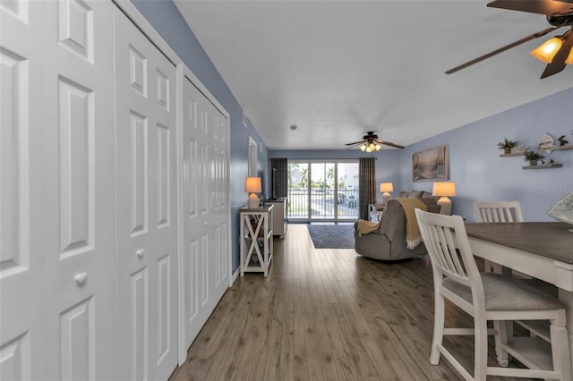 dining space featuring ceiling fan and wood finished floors