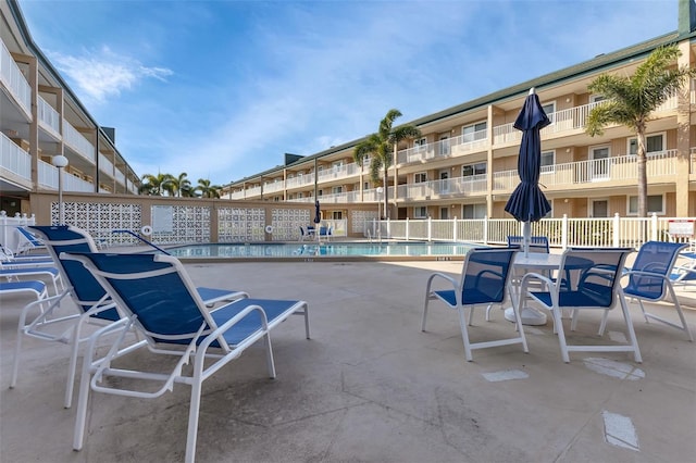 view of patio / terrace featuring a community pool