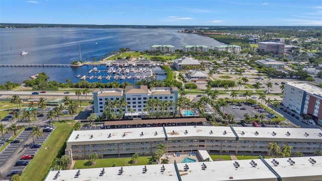 birds eye view of property with a water view