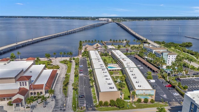 birds eye view of property with a water view