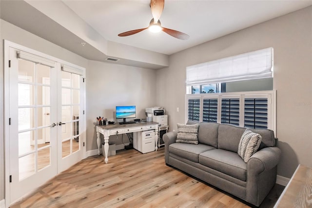 office space with light hardwood / wood-style floors, ceiling fan, and french doors