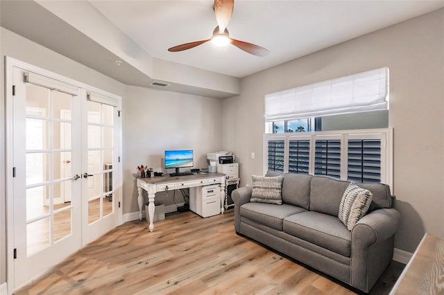 office area with french doors, baseboards, visible vents, light wood-style floors, and ceiling fan