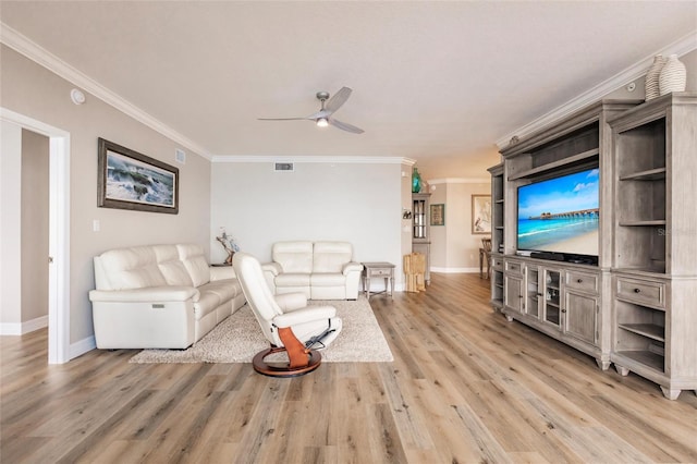 living room with visible vents, light wood-style flooring, ceiling fan, and ornamental molding