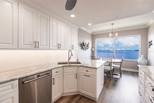 kitchen with a chandelier, crown molding, dishwasher, white cabinetry, and a sink