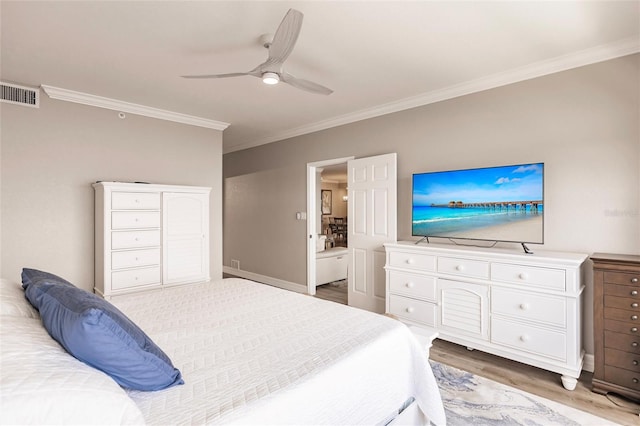 bedroom with crown molding, hardwood / wood-style floors, and ceiling fan