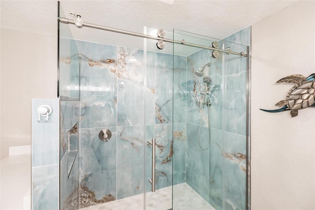 bathroom with walk in shower and a textured ceiling