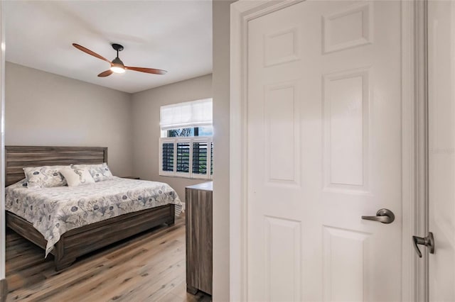 bedroom with ceiling fan and light hardwood / wood-style flooring