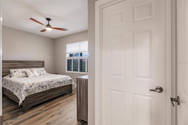 bedroom featuring ceiling fan and light wood-style flooring