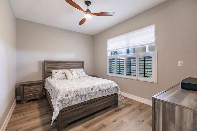 bedroom featuring light hardwood / wood-style flooring and ceiling fan