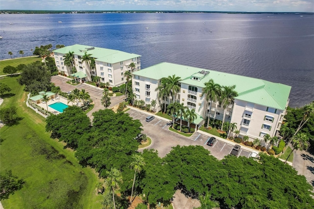 birds eye view of property with a water view