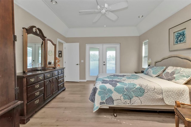 bedroom with ceiling fan, light hardwood / wood-style floors, access to outside, and french doors