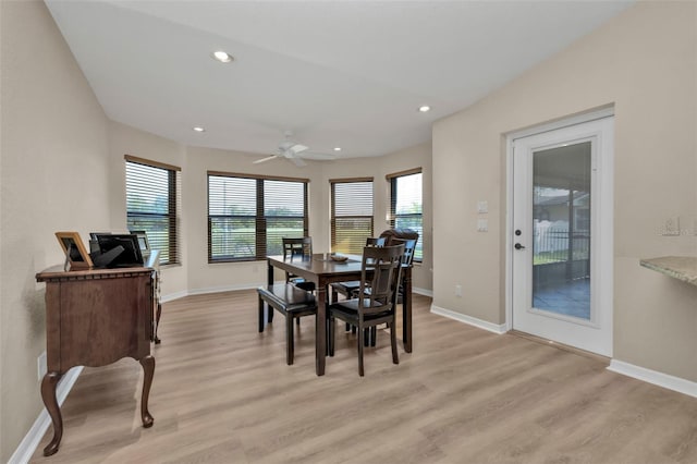 dining area with light hardwood / wood-style floors, a wealth of natural light, and ceiling fan