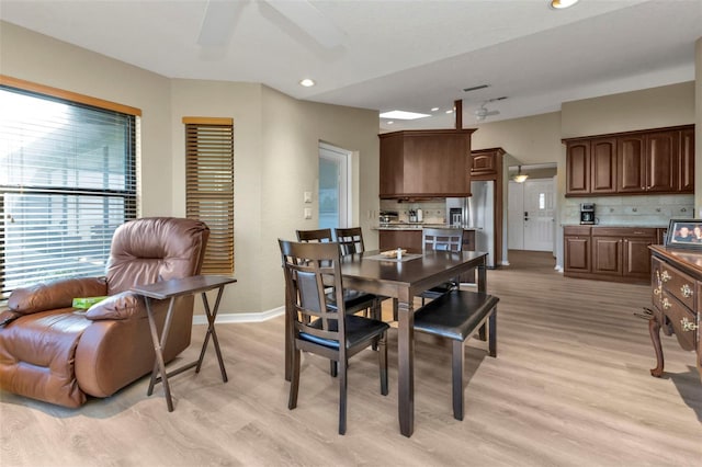 dining space featuring light hardwood / wood-style flooring and ceiling fan