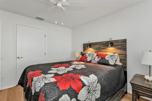 bedroom featuring ceiling fan and light wood-type flooring