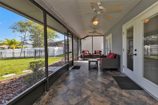 sunroom featuring ceiling fan