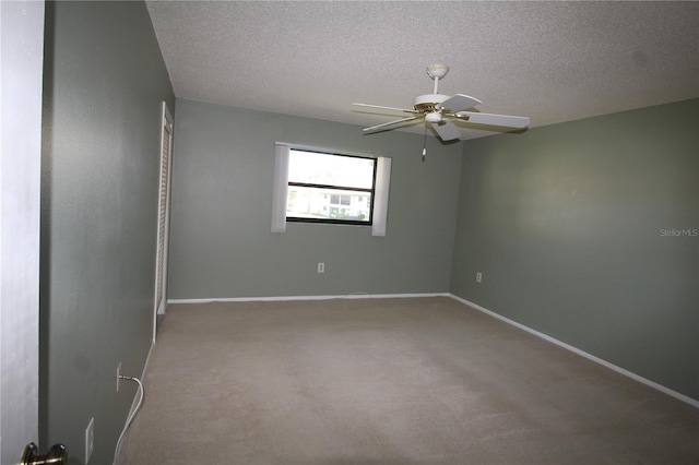 255 Mission Trl S Unit J, Venice, FL 34285 - carpeted empty room featuring baseboards, a textured ceiling, and ceiling fan