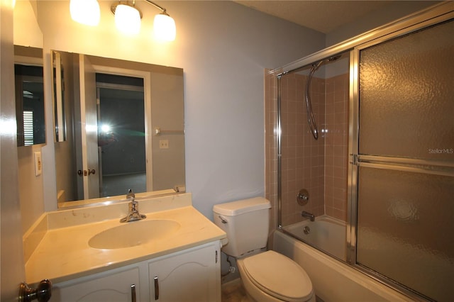 255 Mission Trl S Unit J, Venice, FL 34285 - bathroom featuring toilet, vanity, and enclosed tub / shower combo