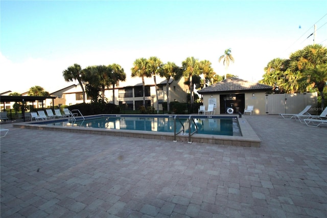 view of swimming pool with a patio area