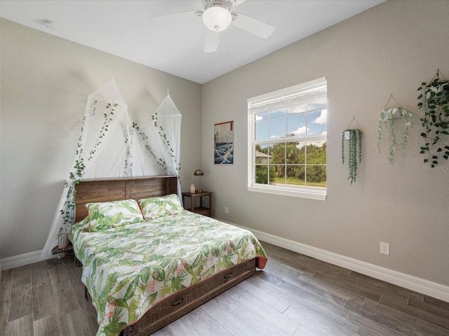 bedroom featuring ceiling fan and hardwood / wood-style flooring