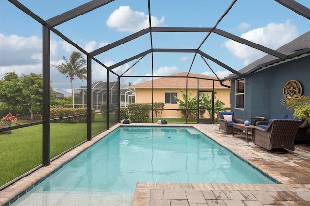 view of pool featuring a lawn, an outdoor hangout area, glass enclosure, and a patio area