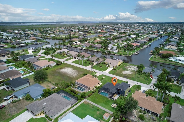 bird's eye view with a water view