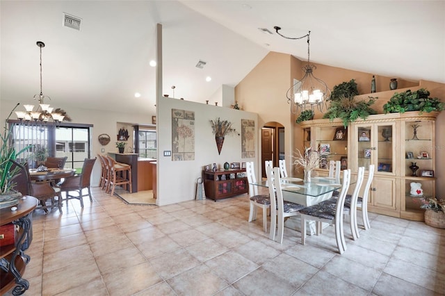 dining space with a notable chandelier and high vaulted ceiling