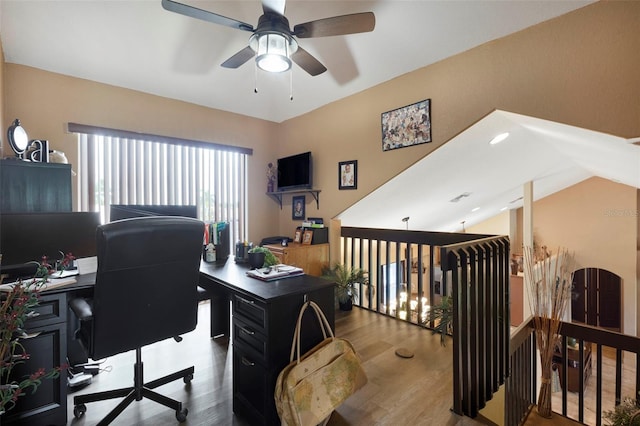 office with wood-type flooring, lofted ceiling, and ceiling fan