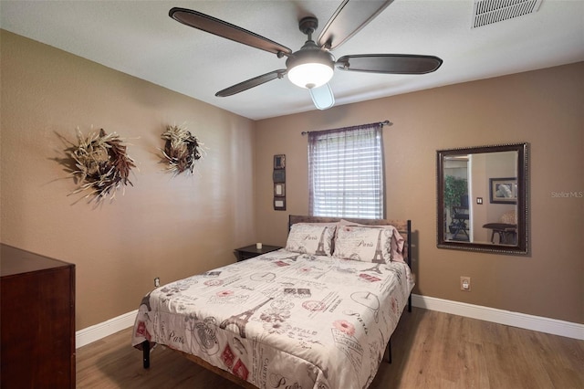 bedroom featuring wood-type flooring and ceiling fan