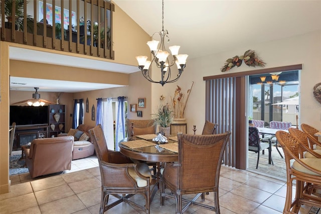 tiled dining room featuring vaulted ceiling and a chandelier