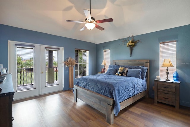 bedroom featuring ceiling fan, access to exterior, french doors, and dark hardwood / wood-style flooring