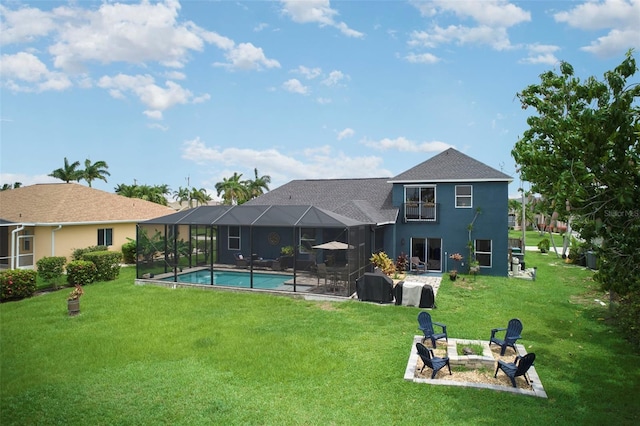 rear view of house featuring a lawn, glass enclosure, and a patio area