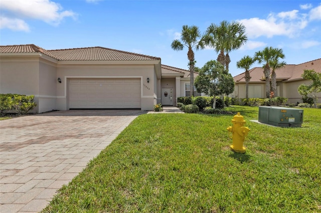 view of front facade with a garage and a front yard