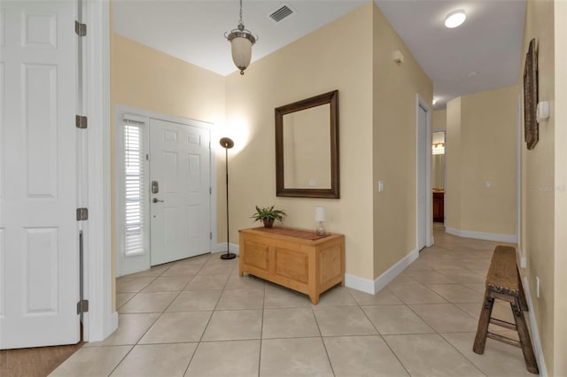 foyer featuring light tile patterned flooring