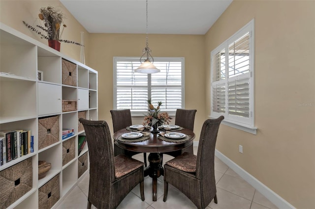 dining space with light tile patterned floors and plenty of natural light