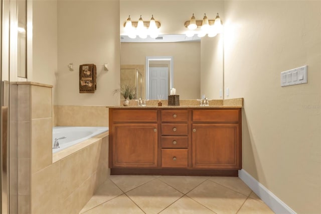 bathroom featuring double vanity, a stall shower, a garden tub, and tile patterned floors