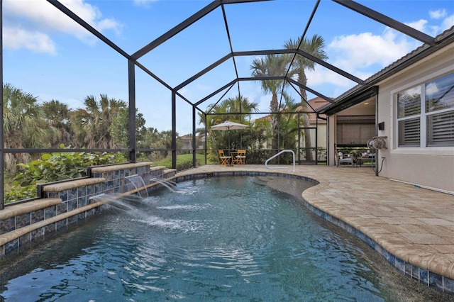 pool with glass enclosure and a patio area