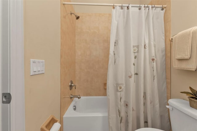 full bathroom with toilet and shower / bath combo with shower curtain