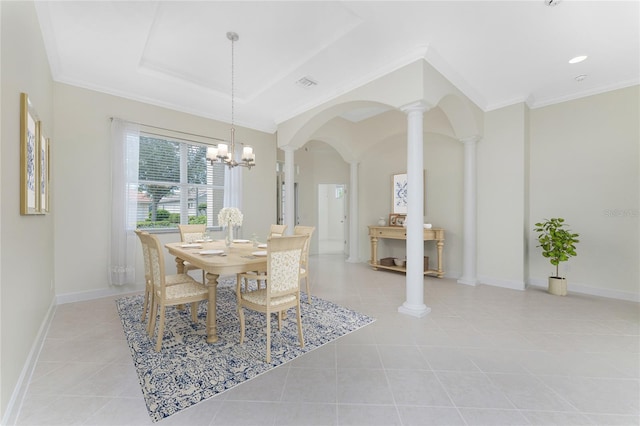 dining area with light tile patterned floors, ornate columns, a notable chandelier, and crown molding