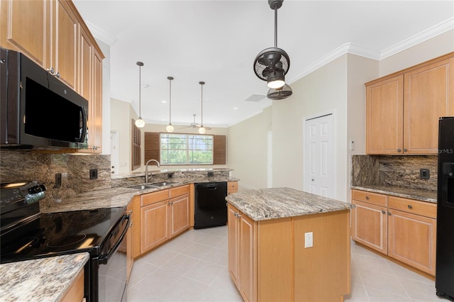 kitchen with light stone countertops, sink, crown molding, a kitchen island, and black appliances