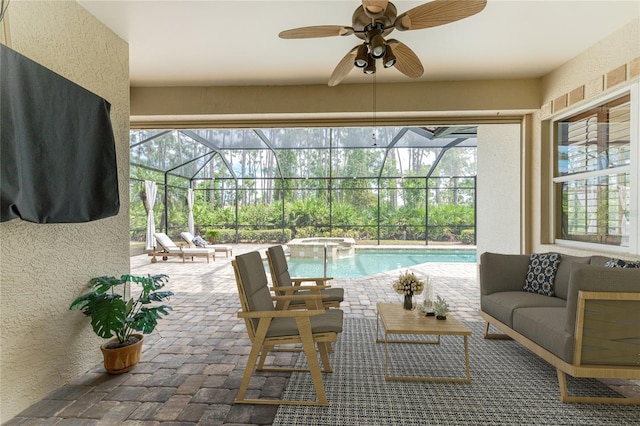 view of patio / terrace featuring glass enclosure, a ceiling fan, and a pool with connected hot tub