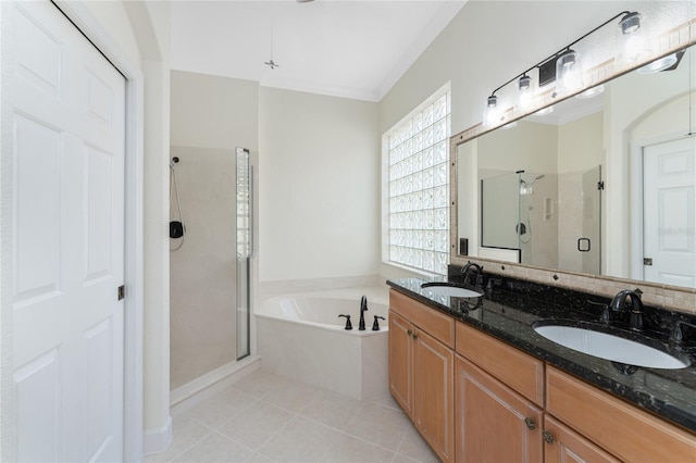 bathroom with tile patterned floors, vanity, ornamental molding, and plus walk in shower